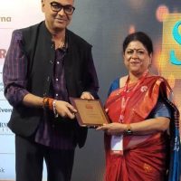 Principal receiving award at event, NEPS, Patna, 2025