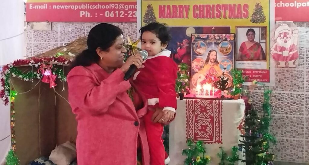 Christmas Celebration with Principal ma'am2022–2023 at NEPS on a decorated stage with holiday decorations