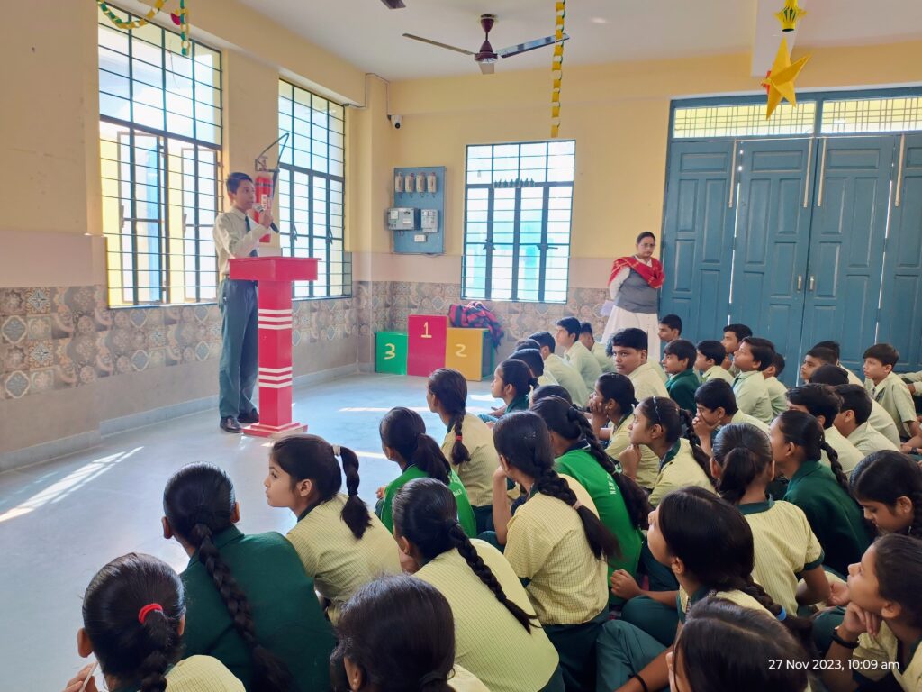 Students presenting speech on Guru Nanak Jayanti at NEPS Patna